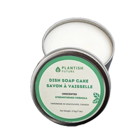 Mimro Plantish solid natural dish soap cake shown in a clear soap dish with a smooth, rounded shape on a neutral background.