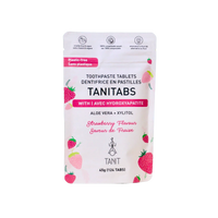 Tanit strawberry toothpaste tablets by mimro, showing a close-up of the tablet packaging with tablets inside and a strawberry flavor theme.